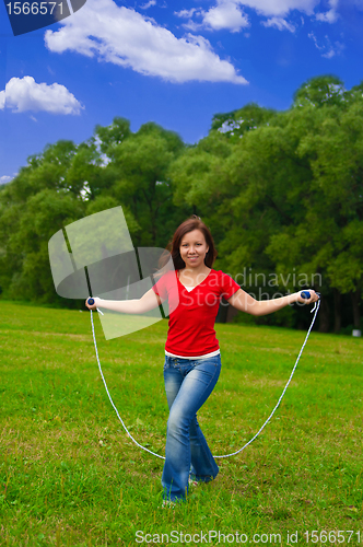 Image of Young woman with skipping rope