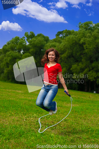 Image of Young woman with skipping rope