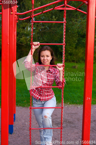 Image of happy young woman on playground