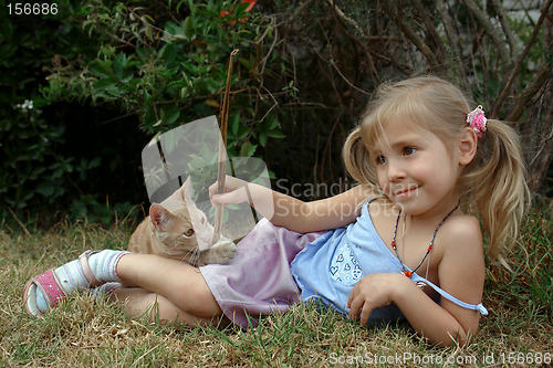 Image of the child play with kitten