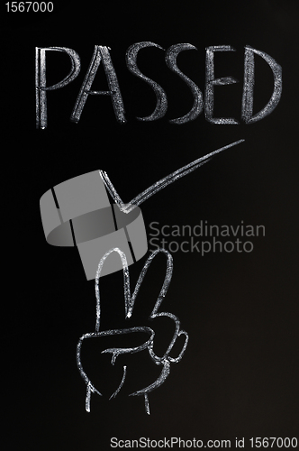 Image of Passed with a victory gesture
