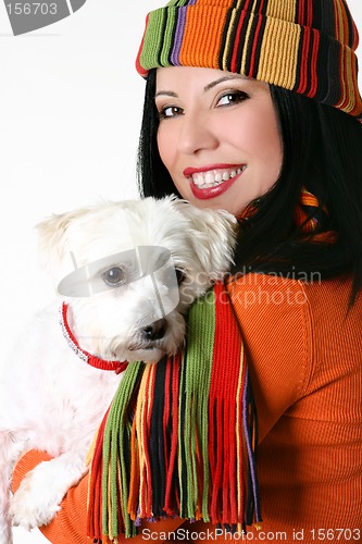 Image of Female cuddling a pet dog