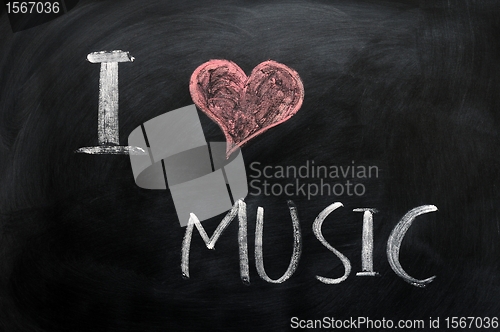 Image of I love music - text written on a blackboard