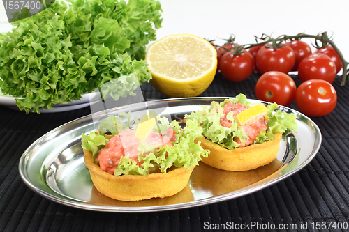 Image of baked Cup corn with salmon salad