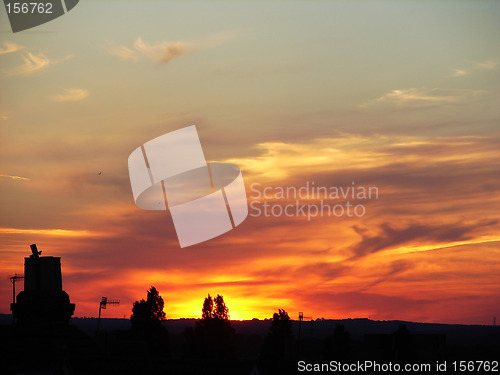Image of sunset rooftop silhouette-1566