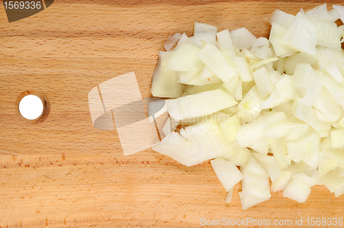 Image of Chopped onions on a wooden board