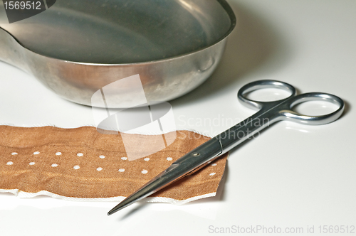 Image of scissors and band-aid