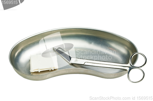 Image of kidney dish with scissors and swaps