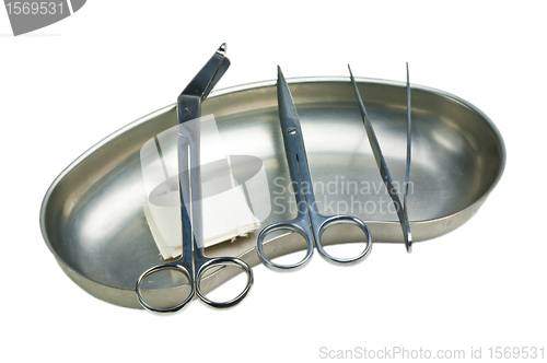 Image of kidney dish with scissors,forceps and swaps