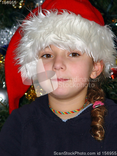 Image of Cute girl in a Christmas hat