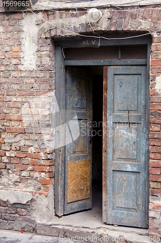 Image of grunge masonry house doors brick wall background 