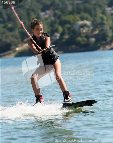 Image of Girl wakeboarding on the lake