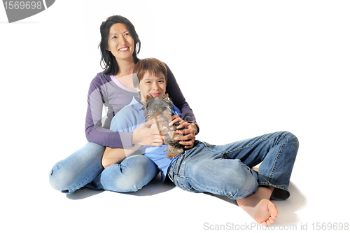 Image of yorkshire terrier and asian family