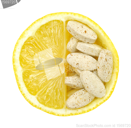 Image of Close up of lemon and pills isolated – vitamin concept - vitamin c