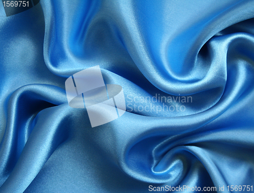 Image of Smooth elegant blue silk as background