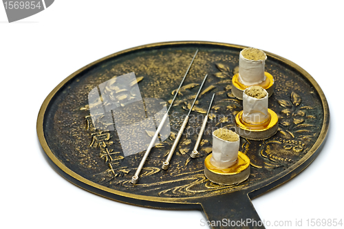 Image of acupuncture needle with moxa cones