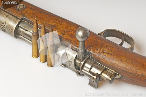 Image of carbine with ammunition
