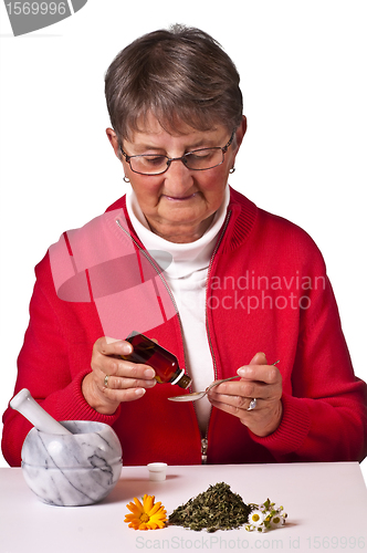 Image of pensioneer taking herbal drops