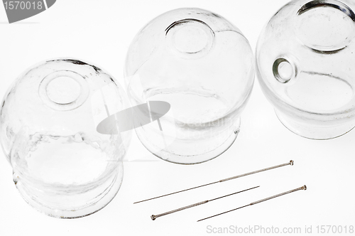 Image of acupuncture needles and cupping glasses