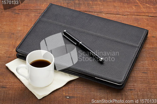 Image of tablet computer with coffee