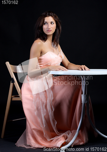 Image of Portrait of young women dressed in a pink dress