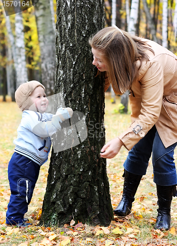 Image of Mother and son play hide-and-seek