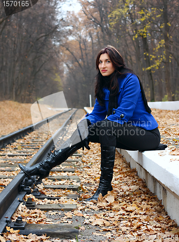 Image of Young woman near the rails