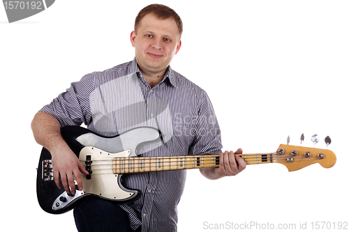 Image of Young man playing guitar
