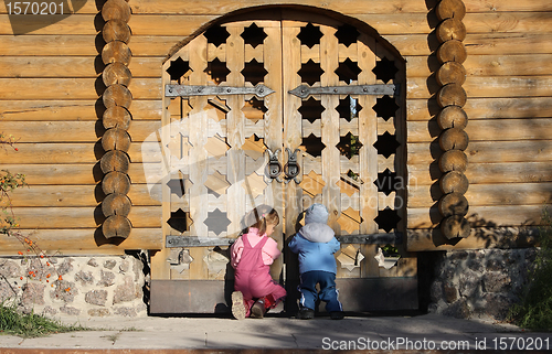 Image of Children near the wooden gates