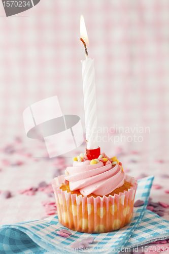 Image of Pink muffin with candle