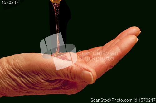 Image of hand with liquid soap