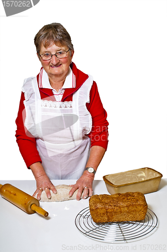 Image of pensioner baking whole grain bread