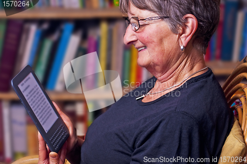 Image of pensioner with e-book reader