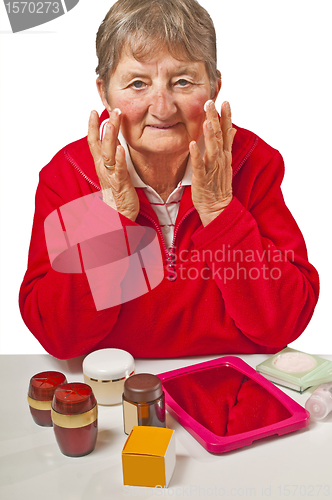 Image of pensioner with cosmetic products