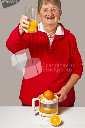 Image of pensioner drinks orange juice