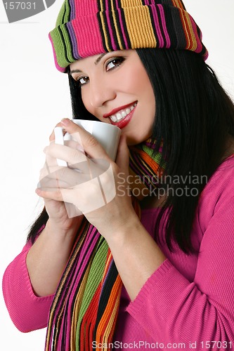 Image of Winter styled woman holding a coffee mug