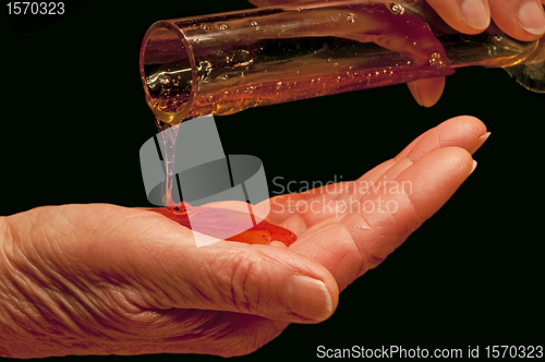 Image of hand with liquid soap