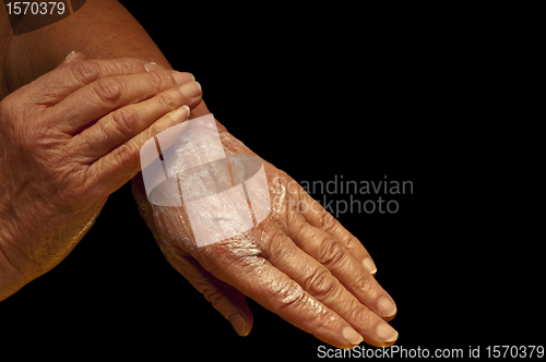 Image of hands with creme