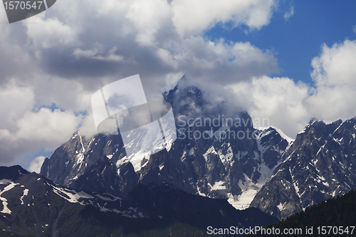 Image of Mt. Ushba in clouds, Caucasus Mountains, Georgia.