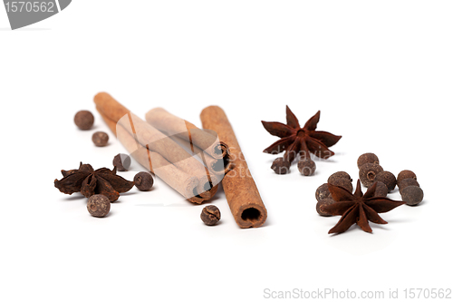 Image of Black peppercorns, anise stars and cinnamon sticks