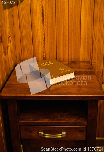 Image of bible on bed side table