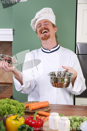 Image of Young chef preparing lunch in kitchen