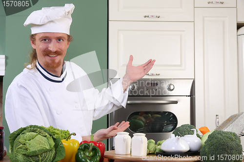 Image of Young chef preparing lunch in kitchen