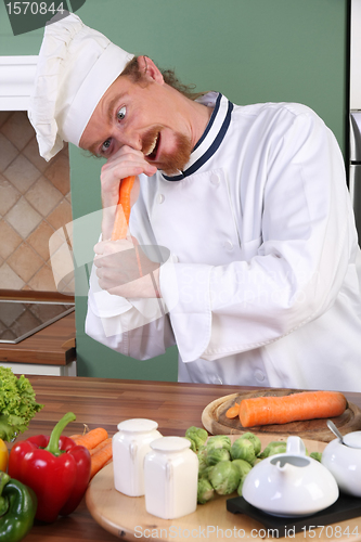Image of Young chef preparing lunch in kitchen
