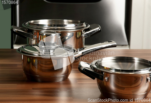 Image of Stainless steel pot with cover in kitchen