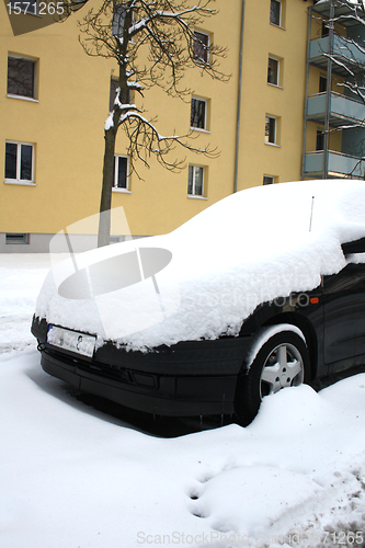 Image of car covered with snow in winter 