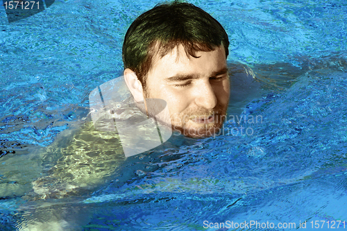 Image of young man in water