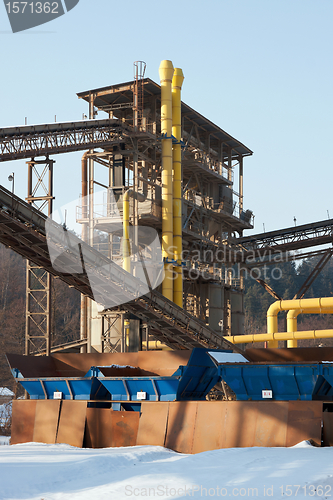 Image of Stone quarry with silos, conveyor belts in winter