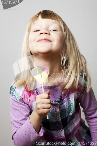 Image of Little girl with lollipop