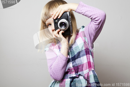 Image of Little girl with camera